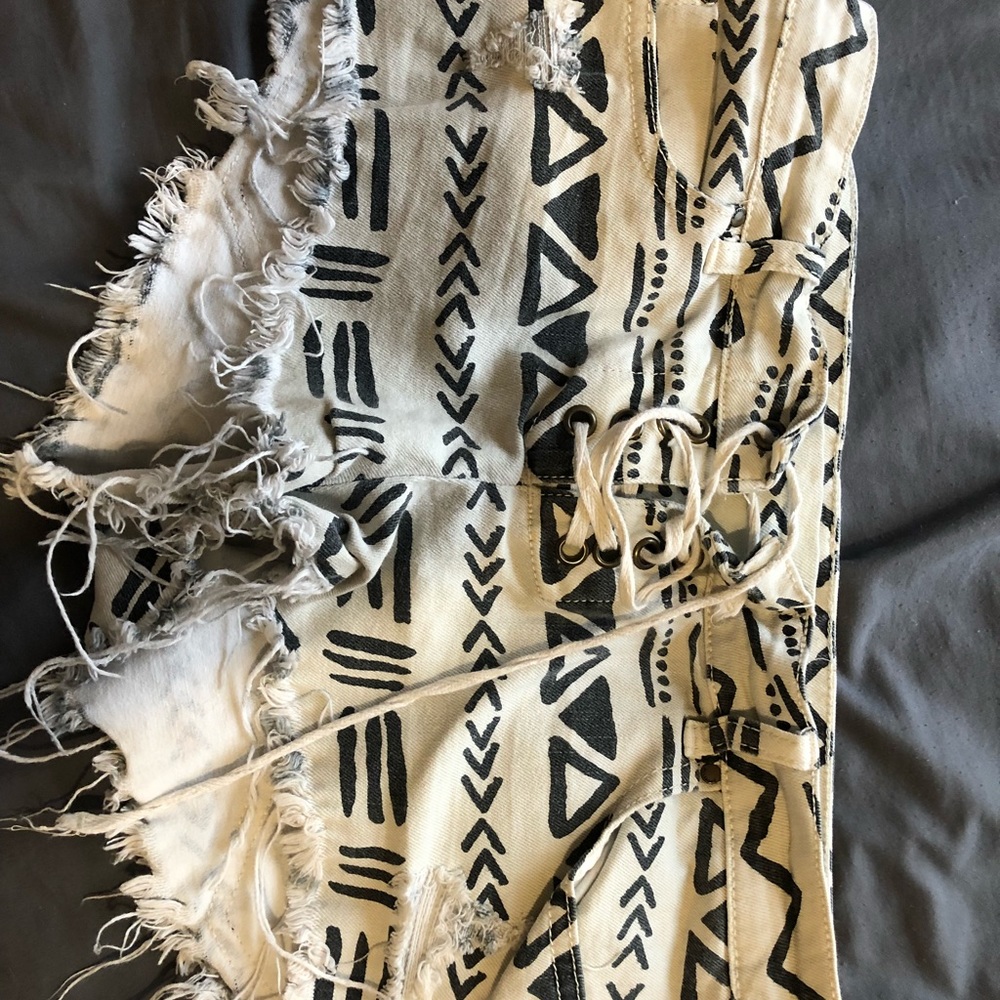 Tribal print distressed jean shorts